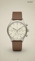 Ivory Taupe Chronograph wristwatch, Default angle: elegant 3/4 wrist perspective or watch placed on textured surface at a...